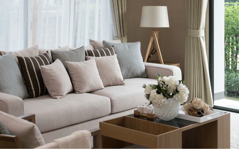 upclose of couch and coffee table in staged living room