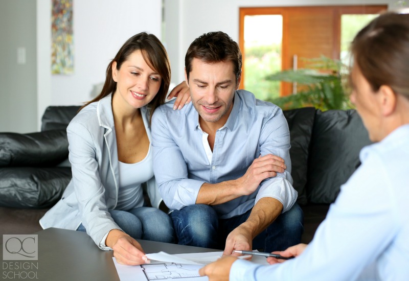 couple looking over professional interior designer's plans