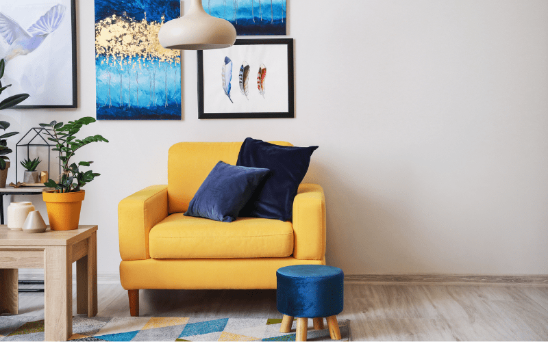 Stylish interior of living room with yellow armchair