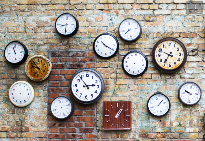 clocks on brick wall