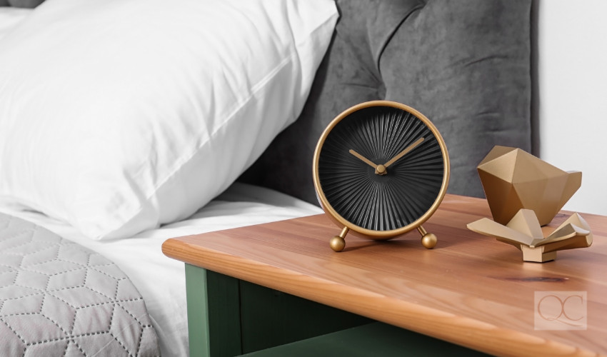 clock on nightstand for time management for new years resolution