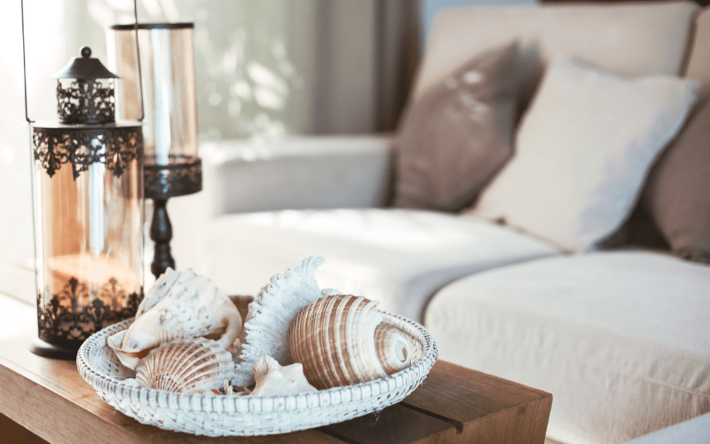 coffee table decor bowl of seashells and lamps