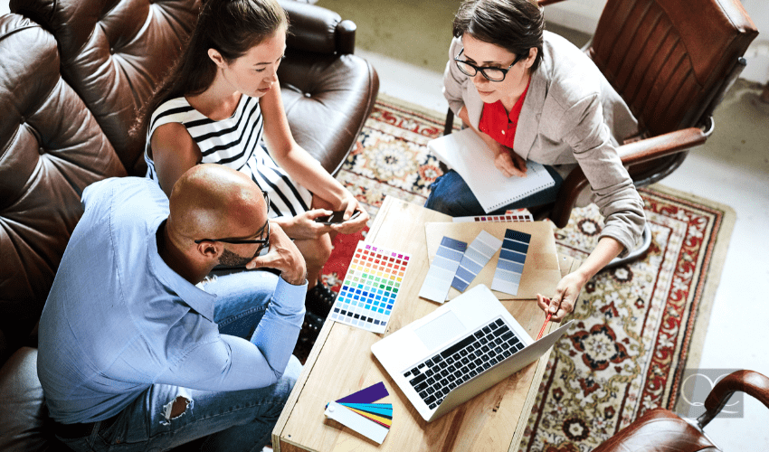 color consultant showing clients something on laptop