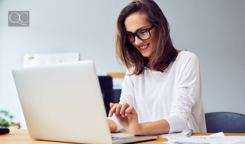 Young woman working with laptop from home office