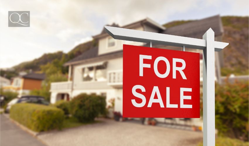 Real estate sign in front of new house for sale