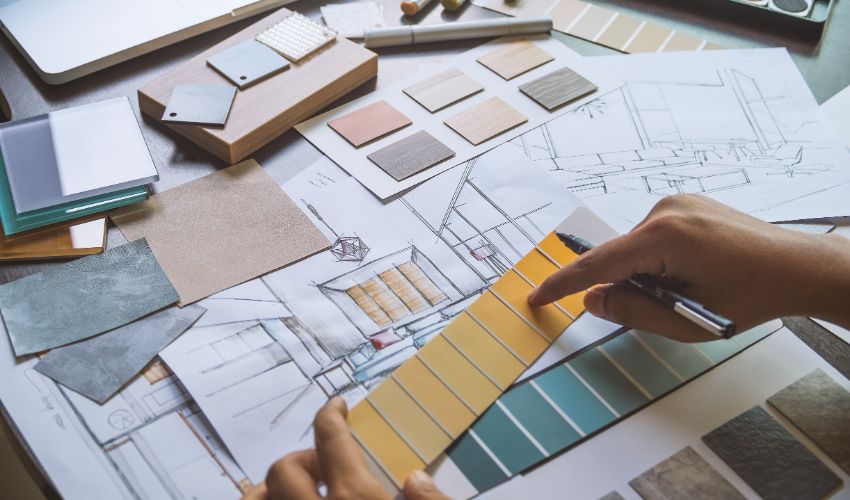 Architect designer Interior creative working hand drawing sketch plan blueprint selection material color samples art tools Design Studio