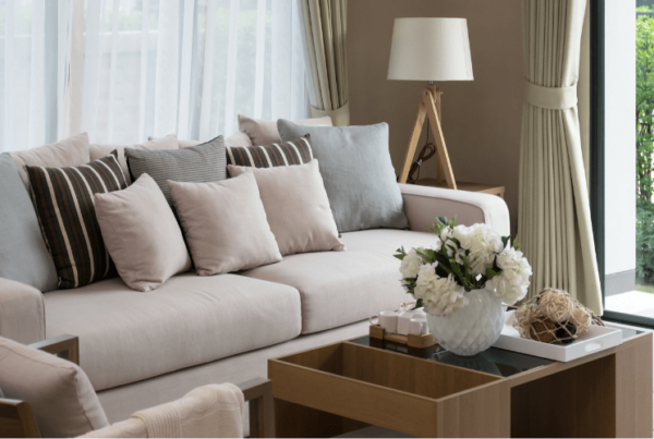 upclose of couch and coffee table in staged living room