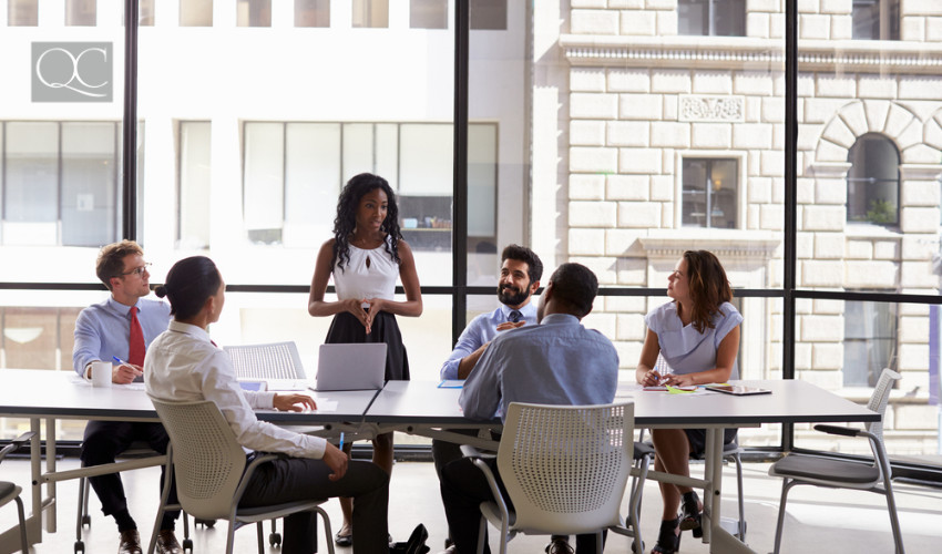 business meeting in meeting room with lots of natural light interior decorating choice