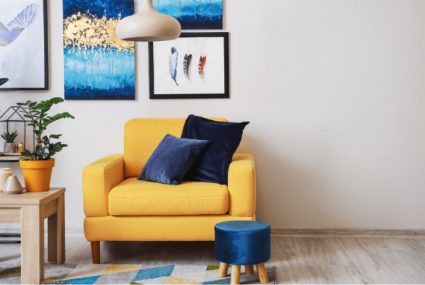 Stylish interior of living room with yellow armchair