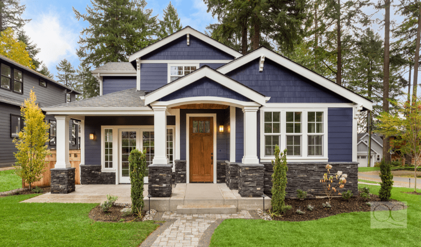 beautiful exterior of naval-colored house with great curb appeal