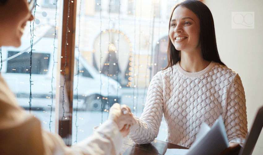 designer shaking hands with client at consultation