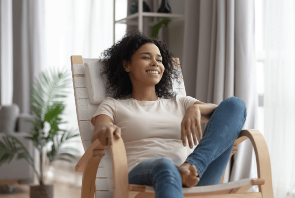 happy woman relaxing in feng shui-designed home