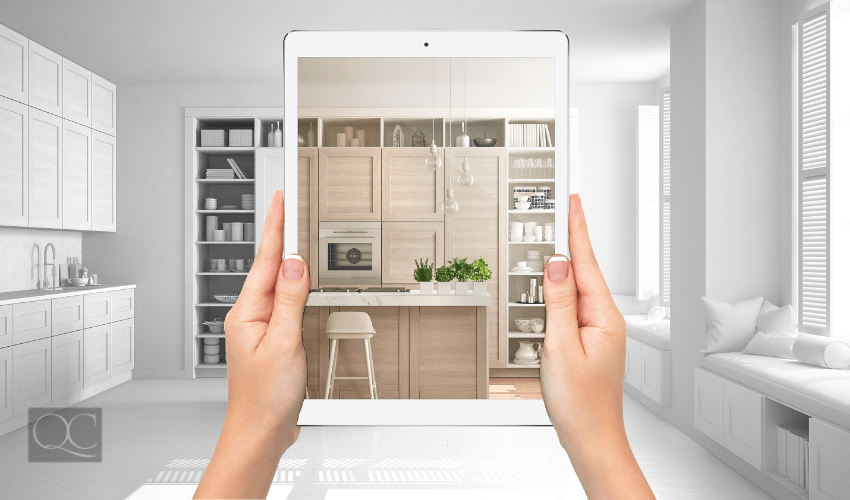 interior designer looking at living room space through ipad device