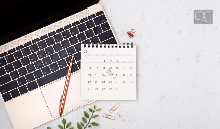 laptop and calendar on table