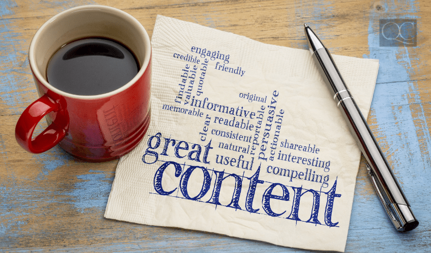 coffee mug and pen with napkin covered in content creation tips