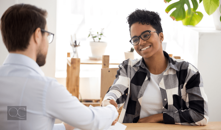 professional shaking hands with happy client