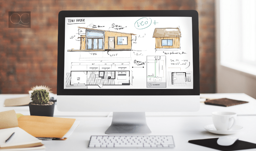 Computer on desk, with home design and floorplan on the screen