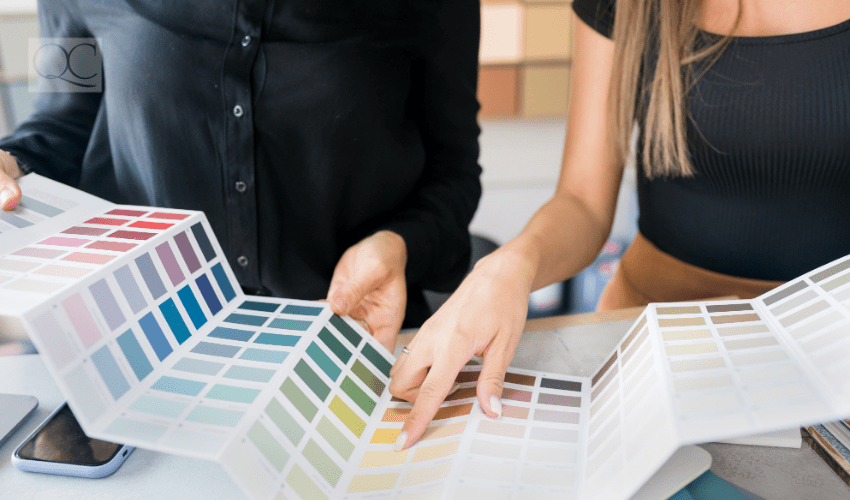 Color consultant showing client color swatches on paper