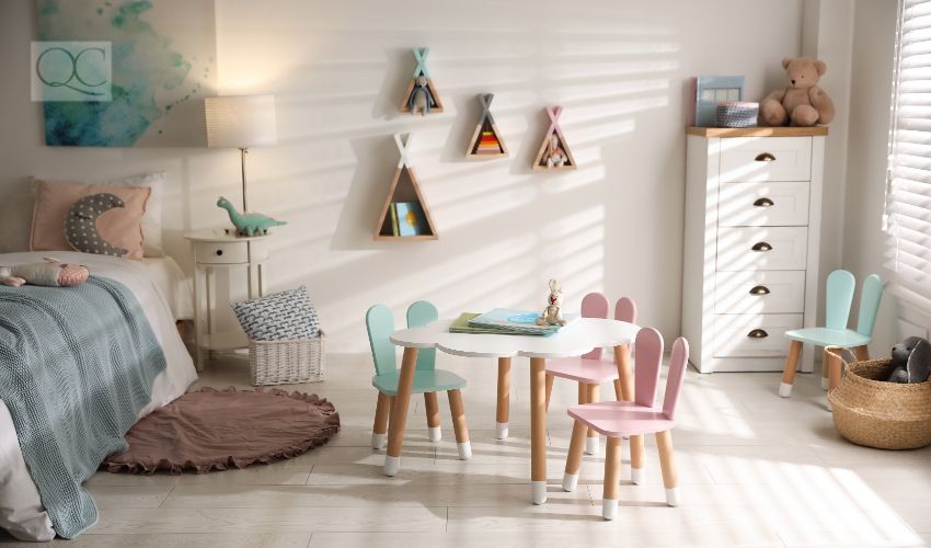 Small table and chairs with bunny ears in children's room interior